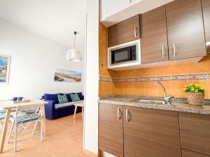 Kuchyňa alebo kuchynka v ubytovaní Plz de la Merced Apartamentos Solera