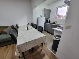 a kitchen and dining room with a table and chairs at Charles House in Brussels