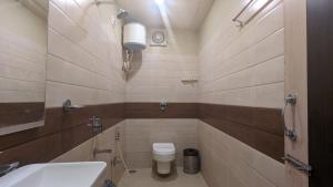 Koupelna v ubytování HOTEL BINAPANI Deluxe 1