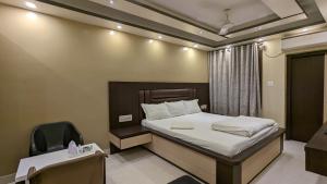 Postel nebo postele na pokoji v ubytování HOTEL BINAPANI Deluxe 1
