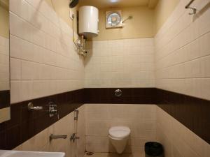 Koupelna v ubytování HOTEL BINAPANI Deluxe 1