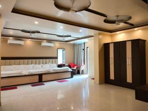 Posezení v ubytování HOTEL BINAPANI Deluxe 1