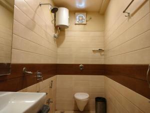 Koupelna v ubytování HOTEL BINAPANI Deluxe 1