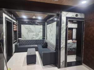 a room with a couch and a bed in it at Sobha homestay in Chhatikara
