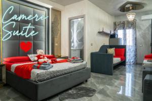a bedroom with a bed with a teddy bear on it at B&B la marica in Adrano