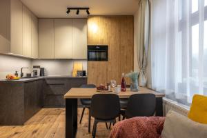 Kuchyň nebo kuchyňský kout v ubytování Apartmány Plavy