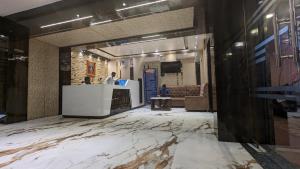 Posezení v ubytování HOTEL BINAPANI Deluxe 1