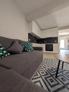 a living room with a couch and a table at Luxury House California 1 in Himare