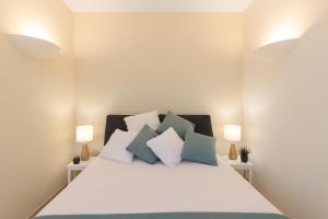Postel nebo postele na pokoji v ubytování VivimiHome - Suite a pochi passi dalla Piazzetta + 18 fotografií