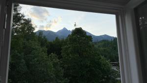 a view of a mountain from a window at Mountain Peak Apartment in Tatranská Lomnica