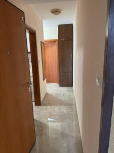 an empty hallway of a house with a door and a room at Apartman Tafra 3 in Igalo