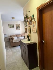 a living room with a couch and a table at Apartman Tafra 3 in Igalo