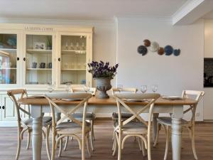 a dining room with a table and chairs at Japy 0401 - Modern 3-Bedroom Apartment in De Panne