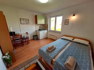 Postel nebo postele na pokoji v ubytování Apartment Carolina + 29 fotografií