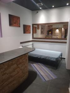 a hospital room with a bed and a counter at Chrysoulas Apartment in Yimnón