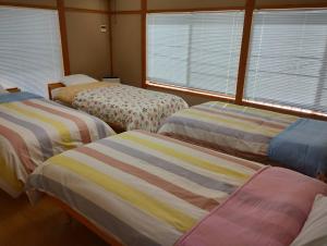 Voodi või voodid majutusasutuse ゆふ山荘 toas