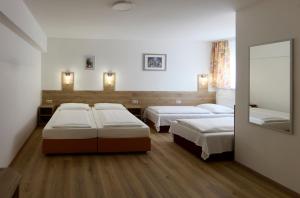 Postelja oz. postelje v sobi nastanitve Hotel Terminus