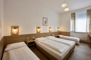 Postel nebo postele na pokoji v ubytování Hotel Terminus