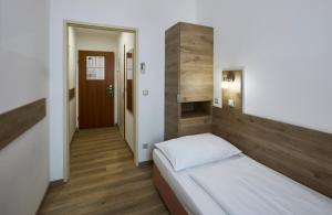 Postelja oz. postelje v sobi nastanitve Hotel Terminus