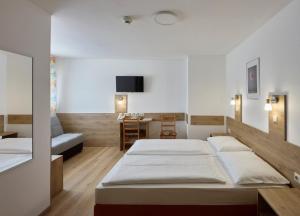 Postelja oz. postelje v sobi nastanitve Hotel Terminus