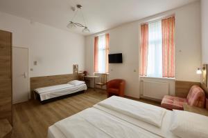 Postelja oz. postelje v sobi nastanitve Hotel Terminus