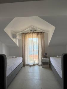 Postel nebo postele na pokoji v ubytování Hotel Xanadu