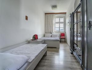 Postel nebo postele na pokoji v ubytování Penzion u Hradilů