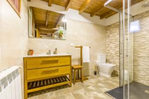 a bathroom with a sink and a toilet at A Casa do Carpinteiro 