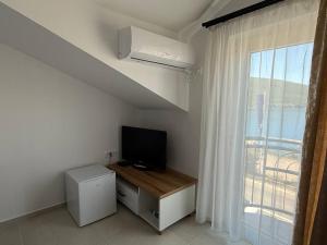 TV a/nebo společenská místnost v ubytování Hotel Xanadu