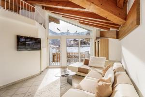 TV a/nebo společenská místnost v ubytování Hotel Etoile & Alpenperle Residences