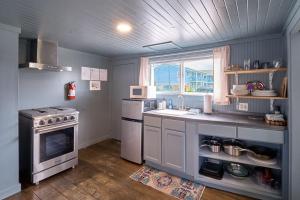a kitchen with a sink and a stove at The Nest #8 in Long Beach