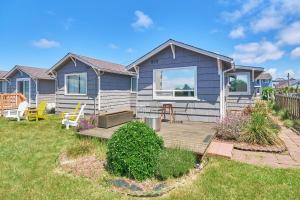 a house with a wooden deck in the yard at The Nest #8 in Long Beach