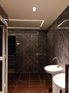 a bathroom with a tub and a sink and a shower at Elsokhna BlueBay Asia For families only in Ain Sokhna