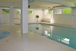 a large swimming pool with a pool at Condominio Vorame by HolAp SA in Ascona