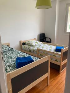 En eller flere senge i et værelse på Les Cimes du Jura