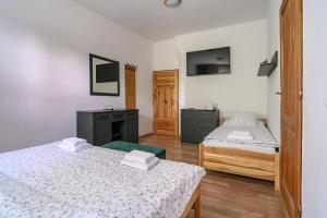Postel nebo postele na pokoji v ubytování Penzion u Hradilů