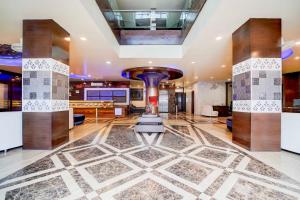 a large lobby with a fireplace and a pool table at Townhouse Oak Lalghati Tekri Bhopal Viewpoint in Bhopal