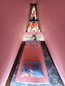 a room with stairs leading up to a tower at Redang Campstay A Frame in Redang Island