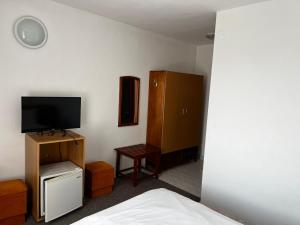 Un televizor și/sau centru de divertisment la Casa Amaradia