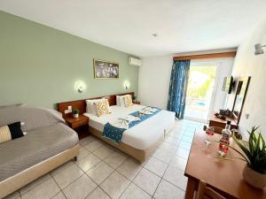 Postel nebo postele na pokoji v ubytování Melitsa corfu hotel