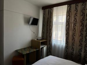 Un televizor și/sau centru de divertisment la Casa Amaradia