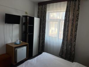 Un pat sau paturi într-o cameră la Casa Amaradia