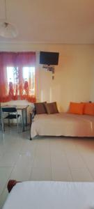 a living room with a couch and a table at Golden Sun Apartments in Rovies +46 photos