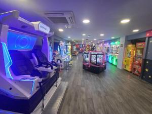a room with several arcade games in a store at Wilerby Winchester in Heysham
