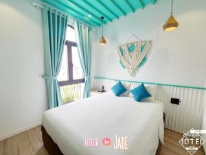 Postel nebo postele na pokoji v ubytování Riverside Mini Hotel Grand World Phu Quoc