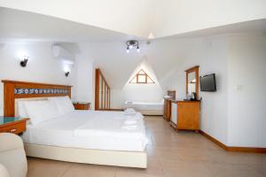Postel nebo postele na pokoji v ubytování Datca Kilic Hotel