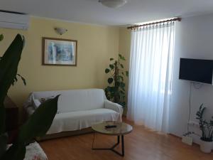 En eller flere senge i et værelse på Apartment & studio Elizabet