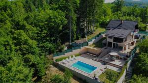 an aerial view of a house with a swimming pool at Villa Hani in Sarajevo