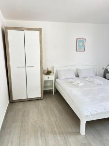 Postel nebo postele na pokoji v ubytování Vilele Delfin