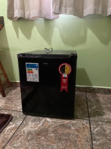 a black box sitting on the floor next to a wall at Trilhos Hotel in São Paulo